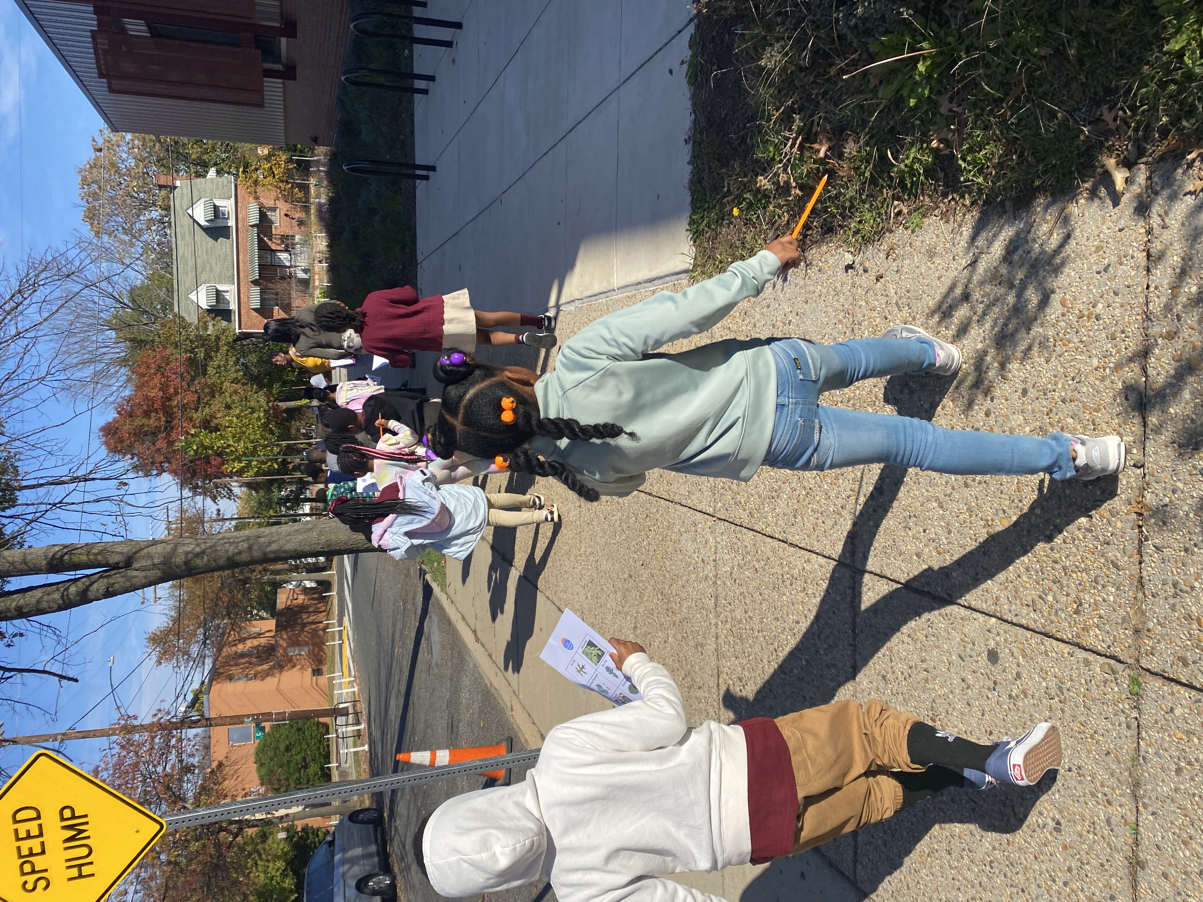 Students walk down a DC sidewalk together